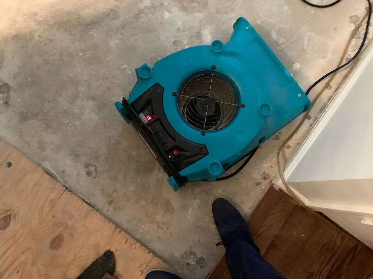 Air mover drying subfloor during Leak Detection & Repair in Catoosa
